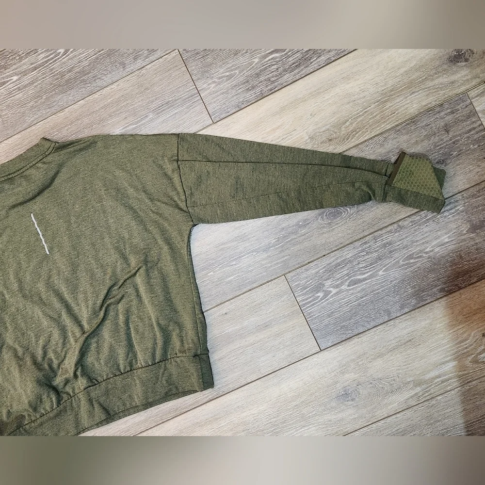 The Nike Running Women's Dri-Fit Crop Top Sweater in size Xsmall and olive green